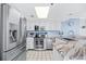 Stainless steel appliances and granite countertops in a bright kitchen at 1015 S Ocean Blvd. # 604, North Myrtle Beach, SC 29582