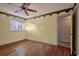 Bedroom with wood flooring, ceiling fan and neutral walls at 10301 N Kings Hwy. # 17-3, , SC 29572