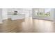 Open kitchen with white cabinets, granite countertops, and island at 1073 Nw Rosefield Way, Calabash, NC 28467
