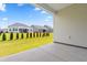 View from covered patio of backyard and homes at 1073 Nw Rosefield Way, Calabash, NC 28467