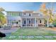 Large backyard with screened porch, patio, and mature trees at 116 Saint James St., Georgetown, SC 29440