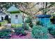 Landscaped backyard with two sheds and flowering bushes at 116 Saint James St., Georgetown, SC 29440