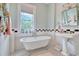 Bathroom with clawfoot tub, pedestal sink, and black and white tile at 116 Saint James St., Georgetown, SC 29440