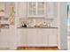 White built-in cabinets and a dark countertop butlers pantry at 116 Saint James St., Georgetown, SC 29440