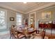 Bright dining room with hardwood floors, large windows, and decorative ceiling at 116 Saint James St., Georgetown, SC 29440
