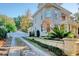 Private driveway with white gate leading to a charming stone home at 116 Saint James St., Georgetown, SC 29440