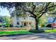 Grand two-story home with stone facade, mature trees, and a classic front porch at 116 Saint James St., Georgetown, SC 29440