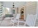 Charming front porch with rocking chairs and a porch swing at 116 Saint James St., Georgetown, SC 29440