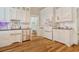 Updated kitchen with white cabinets, stainless steel appliances, and hardwood floors at 116 Saint James St., Georgetown, SC 29440