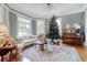 Cozy living room with hardwood floors, a Christmas tree, and comfortable seating at 116 Saint James St., Georgetown, SC 29440