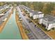 Aerial view showing apartment buildings, a waterway, and parking at 1238 River Oak Dr. # D, Myrtle Beach, SC 29579