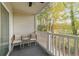 Relaxing balcony with wooded views and two wicker chairs at 1238 River Oak Dr. # D, Myrtle Beach, SC 29579