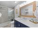 Modern bathroom with a walk-in shower and a navy blue vanity at 1238 River Oak Dr. # D, Myrtle Beach, SC 29579