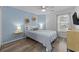 Bedroom with light blue walls, a bed and TV at 1238 River Oak Dr. # D, Myrtle Beach, SC 29579
