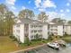Two-story condo building with parking and landscaping at 1238 River Oak Dr. # D, Myrtle Beach, SC 29579