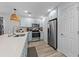 Modern kitchen with stainless steel appliances and light blue cabinets at 1238 River Oak Dr. # D, Myrtle Beach, SC 29579