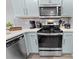 Modern kitchen with stainless steel appliances and light blue cabinets at 1238 River Oak Dr. # D, Myrtle Beach, SC 29579