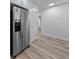 Stainless steel refrigerator in kitchen with light wood floors at 1238 River Oak Dr. # D, Myrtle Beach, SC 29579