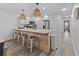Open kitchen with island seating and light wood flooring at 1238 River Oak Dr. # D, Myrtle Beach, SC 29579
