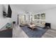 Living room with two sofas, a coffee table, and a large TV at 1238 River Oak Dr. # D, Myrtle Beach, SC 29579