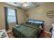 Green bedroom with a king bed, ceiling fan, and ample closet space at 1286 River Oaks Dr. # 8B, Myrtle Beach, SC 29579