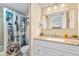 Bathroom with granite countertop, shower, and coastal-themed decor at 2001 S Ocean Blvd. # 818, Myrtle Beach, SC 29577