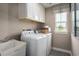 Bright laundry room with washer, dryer, and utility sink at 2218 Vera Way, Longs, SC 29568