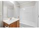 Bathroom with tub, shower, vanity with wood cabinet at 230 Pilot House Pl. # 230, Carolina Shores, NC 28467