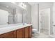 Bathroom with double vanity and walk-in shower at 230 Pilot House Pl. # 230, Carolina Shores, NC 28467
