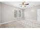 Spacious bedroom with ceiling fan and neutral carpeting at 230 Pilot House Pl. # 230, Carolina Shores, NC 28467