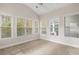 Sunroom with large windows and neutral carpeting at 230 Pilot House Pl. # 230, Carolina Shores, NC 28467