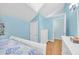 Light blue bedroom with white furniture and wood floors at 307 20Th Ave. S # 4B, Myrtle Beach, SC 29577