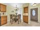 Kitchen dining area with glass-top table and four chairs at 307 20Th Ave. S # 4B, Myrtle Beach, SC 29577