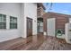 Brown front door with a glass oval window, wooden deck and storage shed at 307 20Th Ave. S # 4B, Myrtle Beach, SC 29577