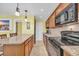 Modern kitchen with granite countertops and black appliances at 307 20Th Ave. S # 4B, Myrtle Beach, SC 29577