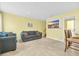 Spacious living room with gray sofas and built-in TV at 307 20Th Ave. S # 4B, Myrtle Beach, SC 29577