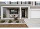 Front porch with wicker chairs and holiday decor at 324 Calhoun Falls Dr., Myrtle Beach, SC 29579