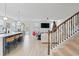 Open concept kitchen and living area with modern staircase at 324 Calhoun Falls Dr., Myrtle Beach, SC 29579