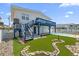 Backyard with pool, putting green, and elevated deck at 333 54Th Ave. N, North Myrtle Beach, SC 29582