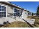 Tan house exterior with white trim, dark shutters, and a porch at 352 Oak Crest Circle, Longs, SC 29568