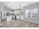 Modern kitchen with white cabinets, stainless steel appliances, and island at 352 Oak Crest Circle, Longs, SC 29568