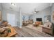 Living room with vaulted ceiling, light gray walls, and LVP flooring at 352 Oak Crest Circle, Longs, SC 29568