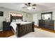 Spacious bedroom with a dark-wood bed frame and dresser at 3940 Loblolly Ave., Little River, SC 29566