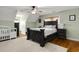 Charming bedroom with a dark-wood bed frame and crib at 3940 Loblolly Ave., Little River, SC 29566