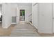 Bright entryway with light wood floors and a red door at 406 Lafayette Rd., Myrtle Beach, SC 29572