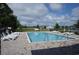 Community pool with lounge chairs and a fenced area at 426 Lifestyle Court, Surfside Beach, SC 29575