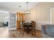 Dining area with round table, four chairs, and a wooden cabinet at 480 Oakham Dr., Conway, SC 29527