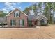 Attractive brick home with green shutters and landscaping at 4800 New Haven Ct., Myrtle Beach, SC 29579