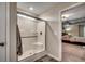 Modern bathroom with a walk-in shower and a view to the bedroom at 5433 Merrywind Ct., Myrtle Beach, SC 29579