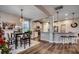 Kitchen and dining area with hardwood floors, modern lighting and island at 5433 Merrywind Ct., Myrtle Beach, SC 29579